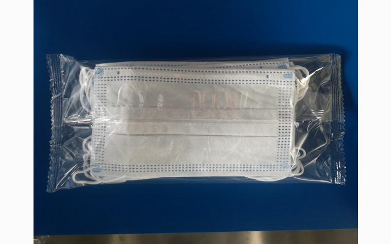 Installation d'une ensacheuse horizontale dans le Pas-De-Calais (62). Emballage de masques et lingettes.