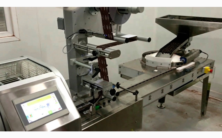 Installation d'une ensacheuse horizontale dans le Vaucluse (84). Emballage de confiseries chocolatées "bords de tasse".