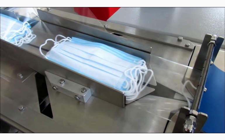 Installation d'une ensacheuse horizontale dans le Pas-De-Calais (62). Emballage de masques et lingettes.