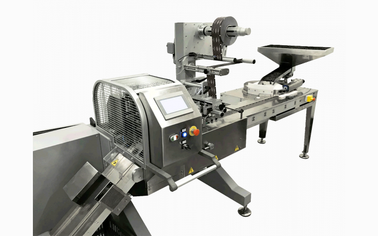 Installation d'une ensacheuse horizontale dans le Vaucluse (84). Emballage de confiseries chocolatées "bords de tasse".