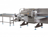 Installation d'une ensacheuse horizontale flowpack dans l'Aisne (02) pour l'emballage de kits de verres optiques et d'accessoires.